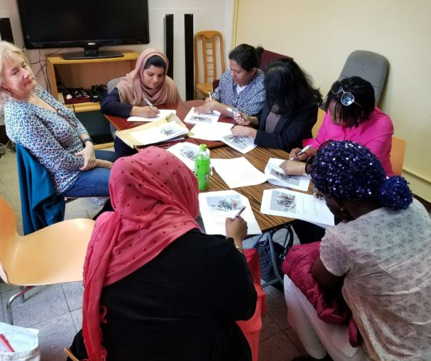 Women students writing 3.png